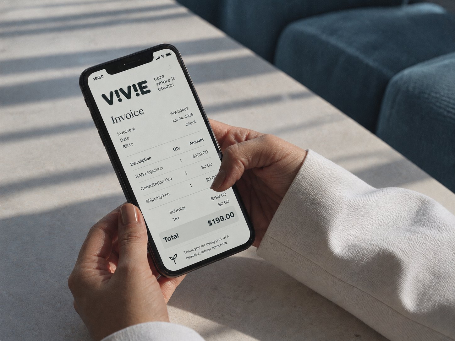 Hands holding a phone showing a VIVIE invoice
